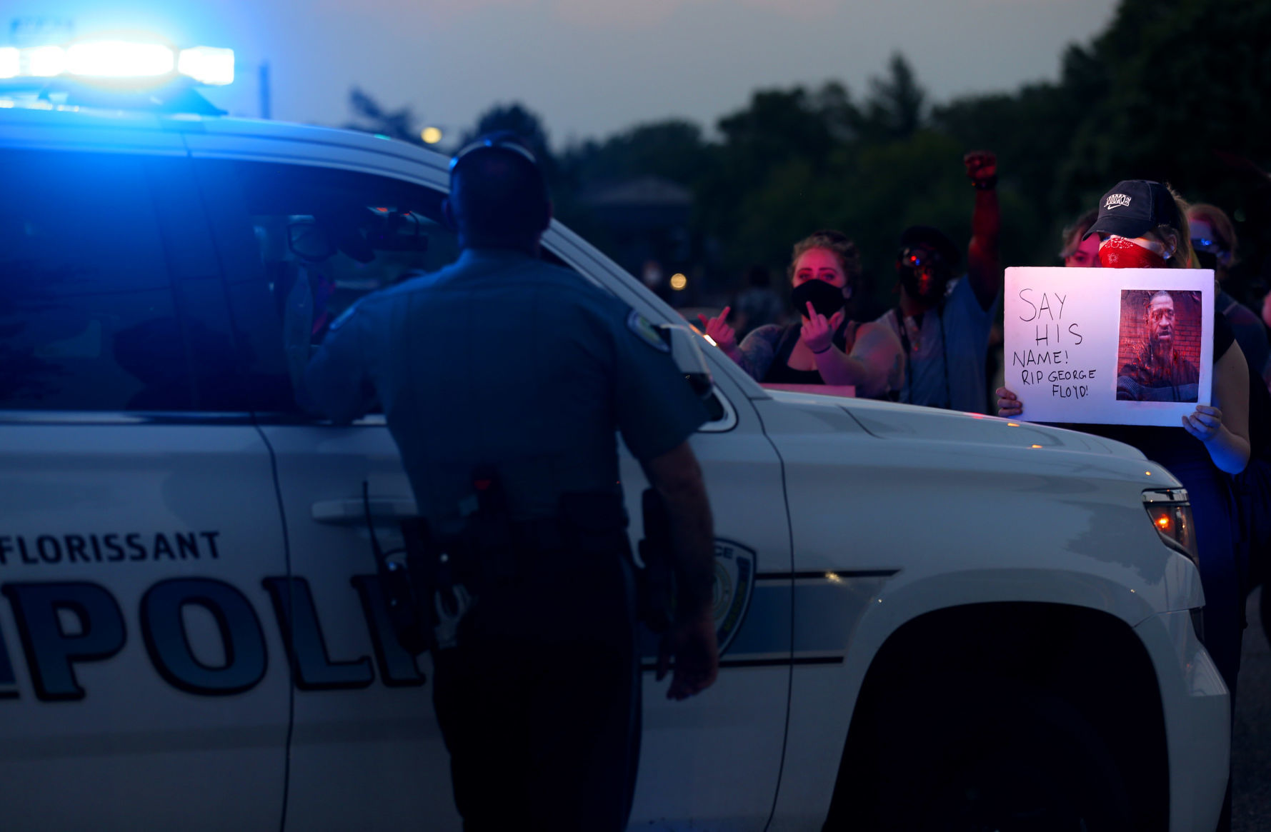 Protesters push for Florissant detective to be fired